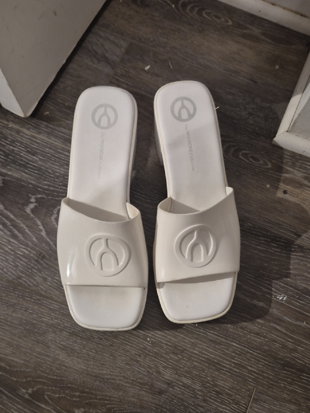 The Whishbone Collection Women's White Slide Mules with Embossed Logo